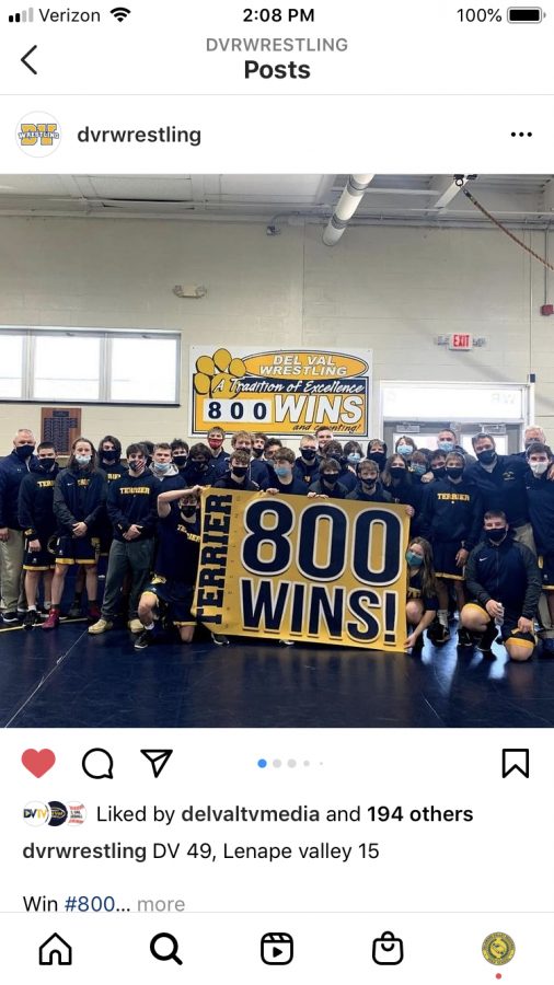 The Del Val Wrestling team celebrates its 800th win in the wrestling room.
