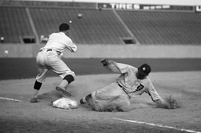 Ty Cobb, one of baseball's greats, slides into the base.