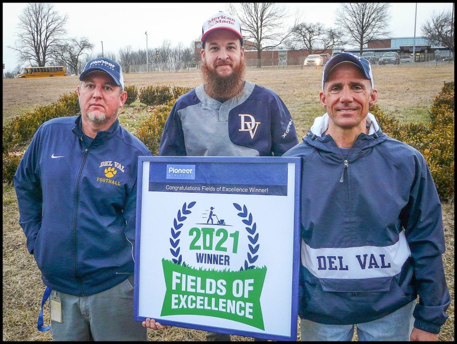 Sylvester%2C+Liskowaski+and+Marinelli%2C+Del+Vals+grounds+crew%2C+proudly+share+their+Fields+of+Excellence+award+with+the+school.