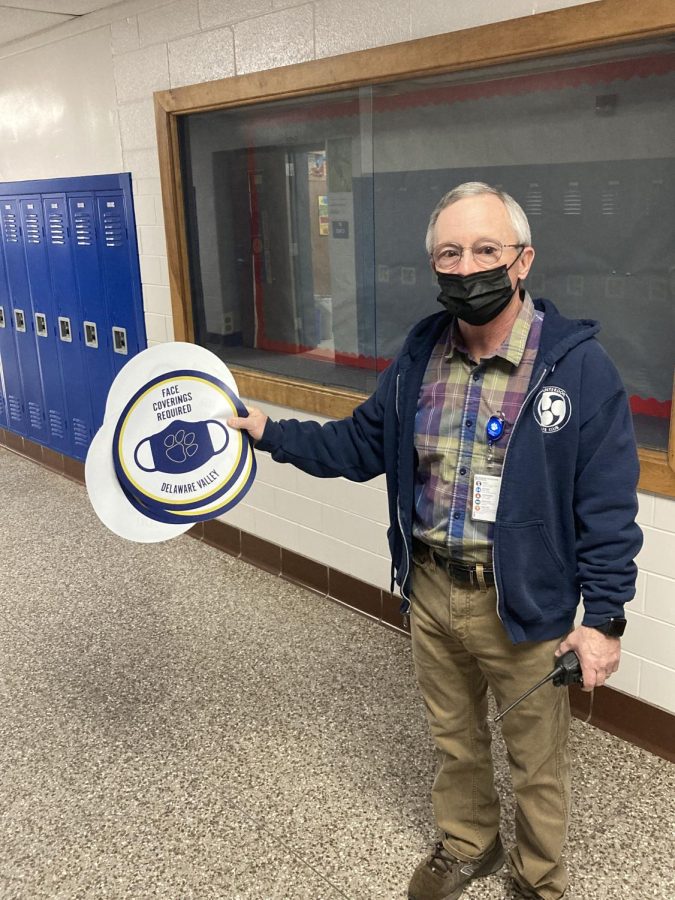 Mr. Lowe traveled the hallways removing the mask signs as the state mask mandates were lifted.