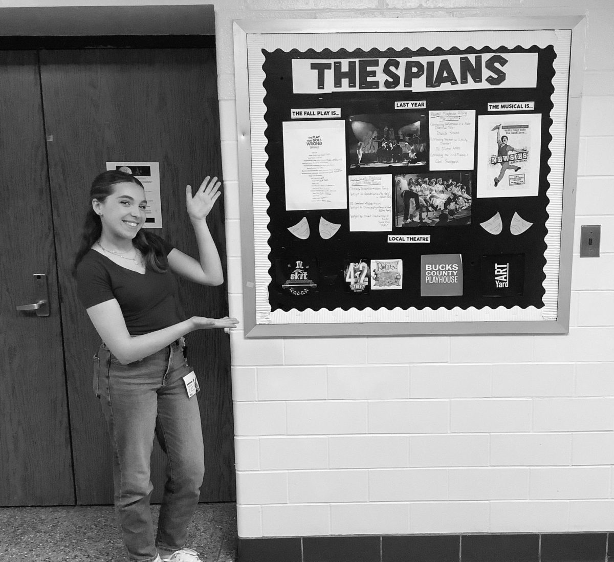 Reporter Jocelyn Denne directs students to check out the Thespians bulletin board outside of the theater.
