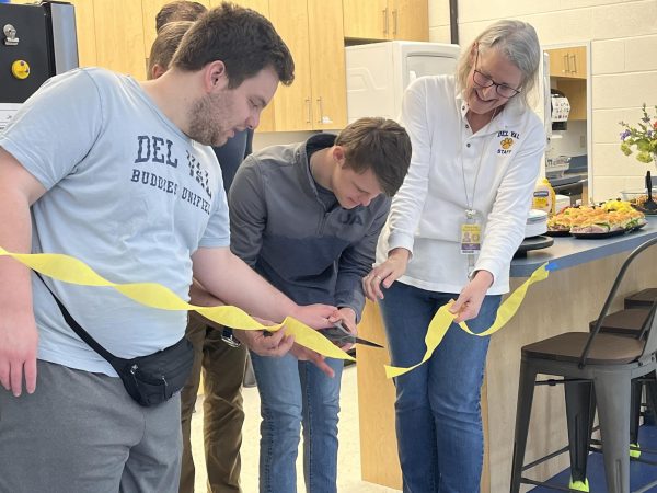 Students Philip Sosidko and Theodore Baransky with teacher Nanette Elder and principal Michael Kays cutting ribbon, signaling the official opening of the new kitchen on Friday, March 15.