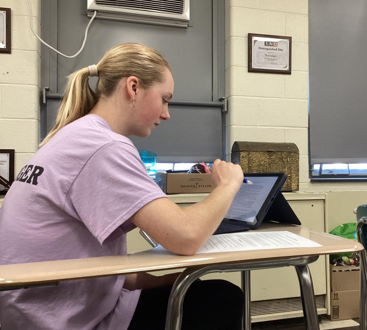 Freshman Emma Haig works diligently on final paper.