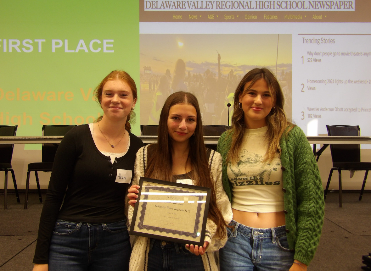 "The Delphi" staff members, Abby Eckert, Gianna Roberts and Juli Findeis, accepting the award at the GSSPA's convention.