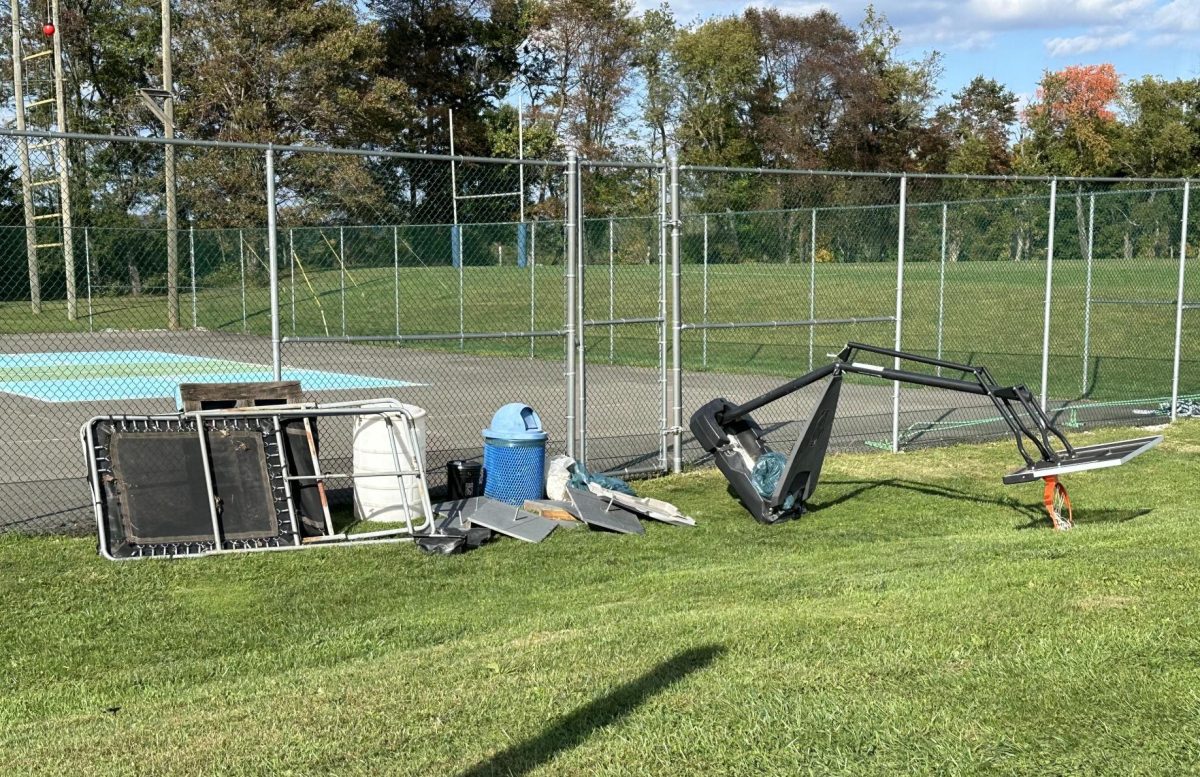 Tennis Club members removed old athletic equipments from the court to begin the court renovation process (photo via Tracy Miceli)