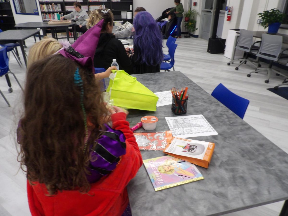 With arts and crafts supplied, children also enjoyed snacks and received other treats to put in their Halloween bags.