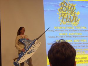 Director, Carrie Snodgrass, announced this year's musical while holding her own "big fish."