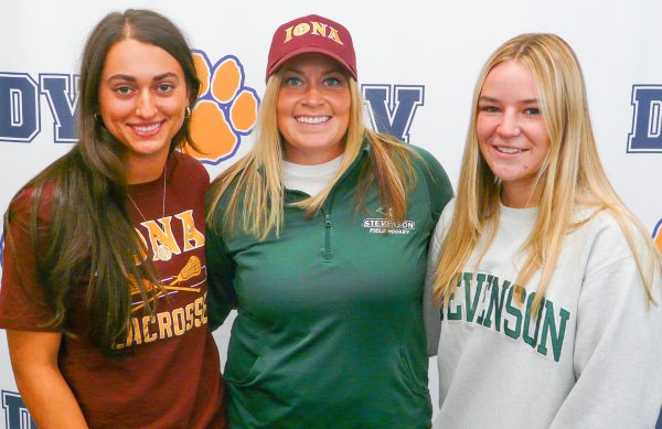 Tavernite (left) and Pinelli (right) celebrate stand with coach Rifflard at their athletic signing in the Commons. College signings are always an exciting time at Del Val, as we get a chance to celebrate the athletic and academic successes of our students.