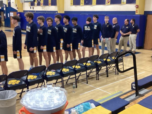 Players get ready for the national anthem to play.