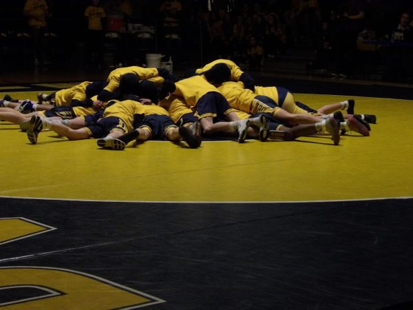 Del Val wrestling team’s Dawg Pile before the Gold Rush begins.