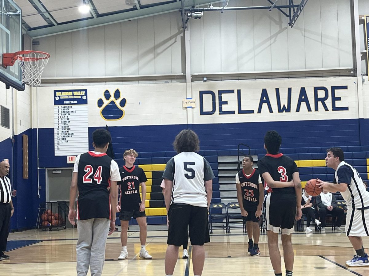 Charlie Bentley shoots a basket on his foul shot in the close game between Del Val and Hunterdon Central.