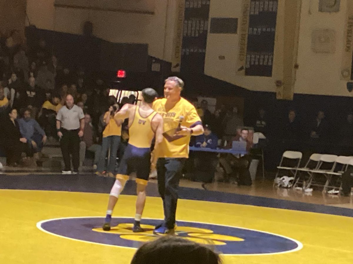 Jaden Perez is awarded for his 100 win.