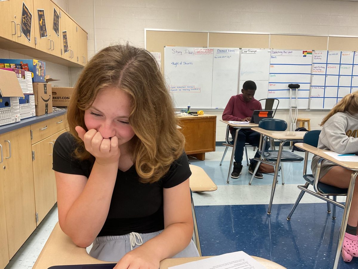Austyn sits at her desk completing her final exam, which is due on June 10, 2025.