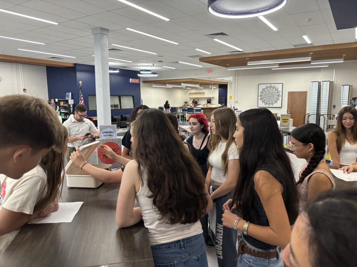 Del Val students working together to solve puzzles during the escape room.