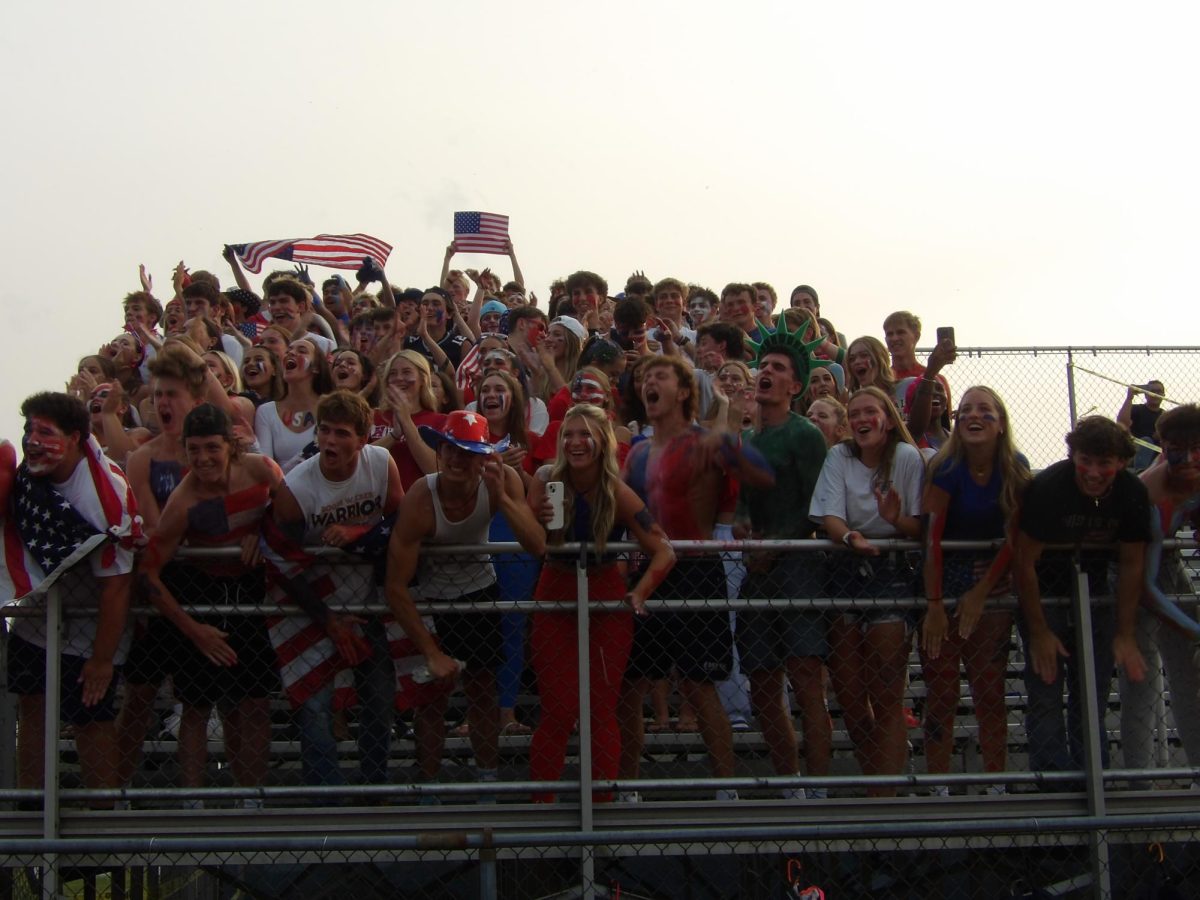 The Dawg Pound cheers on the football team with pride as they begin to win.