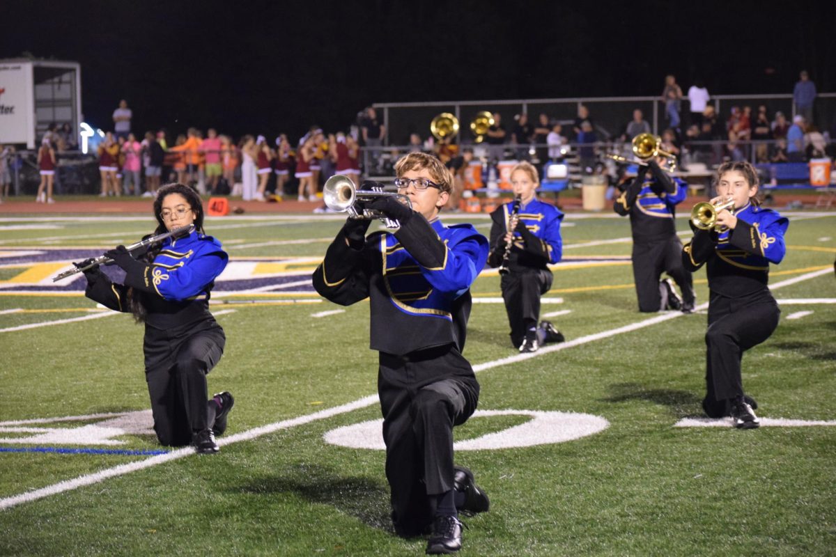 The Del Val Golden Regiment Marching Band performing its show, Artwork, at halftime. The team has been adding new movements to the show each week this season.