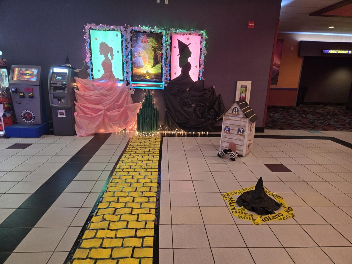 At RC theaters in Quakertown, Pennsylvania there is the "Wicked: For Good" poster with decorations that show the witches, the Wicked Witch's hat, and the Yellow Brick Road. Before entering the theater, viewers got in to the excitement of previewing the movie by taking pictures by the display.