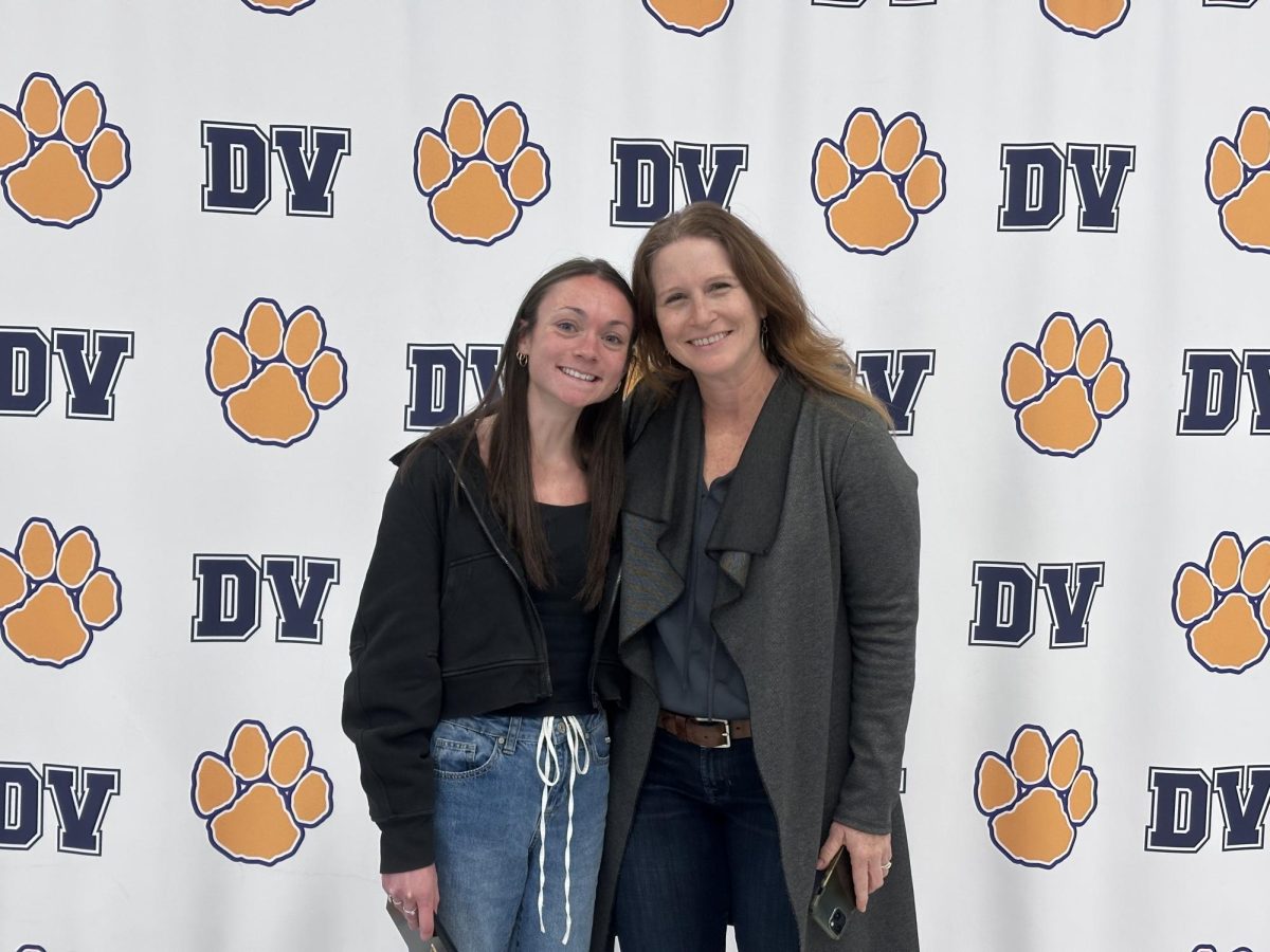 Madison Scott poses alongside Sarah Ruppert following the Arts Hall of Fame induction. Her mandala art work can still be seen in the Del Val Commons. 