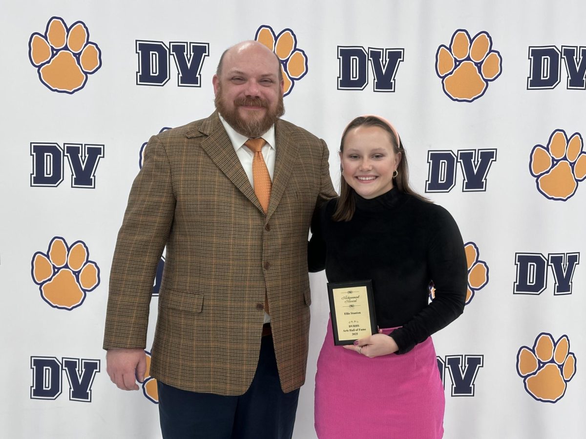 Ellis Stanton poses with Arts Hall of Fame plaque. Stanton graduated from Del Val in 2018, and she now works as an NBC Content Associate. She recently won an Emmy for her coverage of the 2024 Paris Olympic Games. For her full story, visit the article linked above.