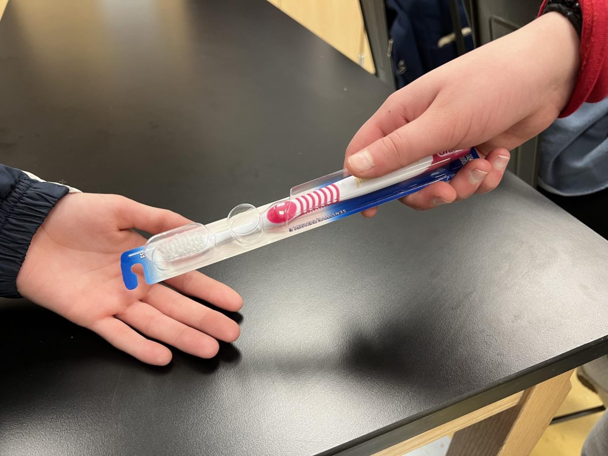Neha Sethi hands a patient a toothbrush and reminds them of the importance of oral hygiene. Through a handful of patient-facing roles, Sethi has confirmed that her childhood dream of becoming a dentist is one that she hopes to make a reality.