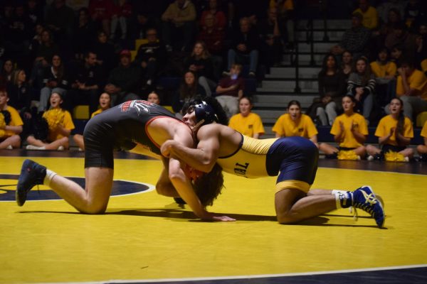 Senior Julian Bednar defeats Hunterdon Central's Brandon Voll by technical fall. Bednar was one of 11 Del Val wrestlers to win during the Gold Rush.