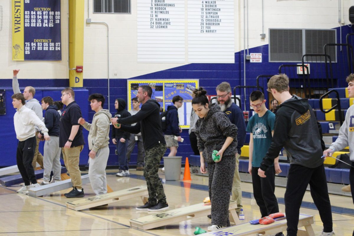 Best Buddies members and other student participants start warming up for the cornhole tournament. The Best Buddies program at Del Val build bonds between differently-abled students and their classmates.