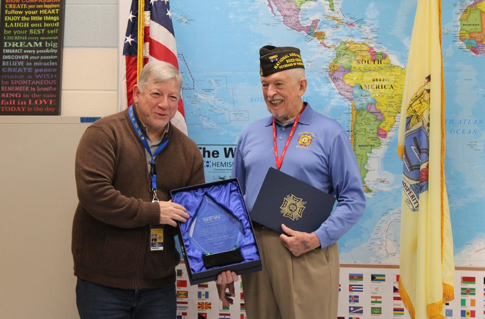 James Kluska with Robert Looby as Kluska is presented an award from the VFW.