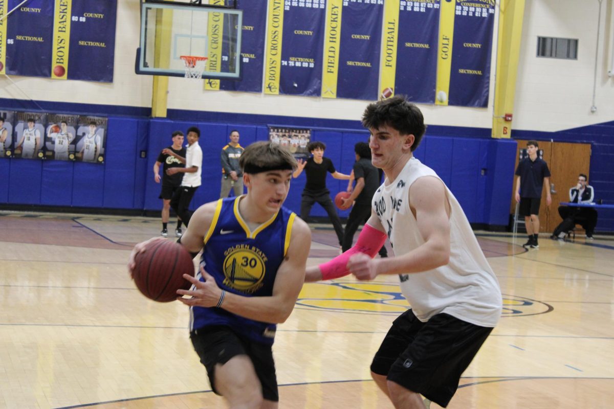 Cooper Fransen steals the ball from Tyler Small. The two teams went head-to-head in the semifinal round of Hoops for Hunger.