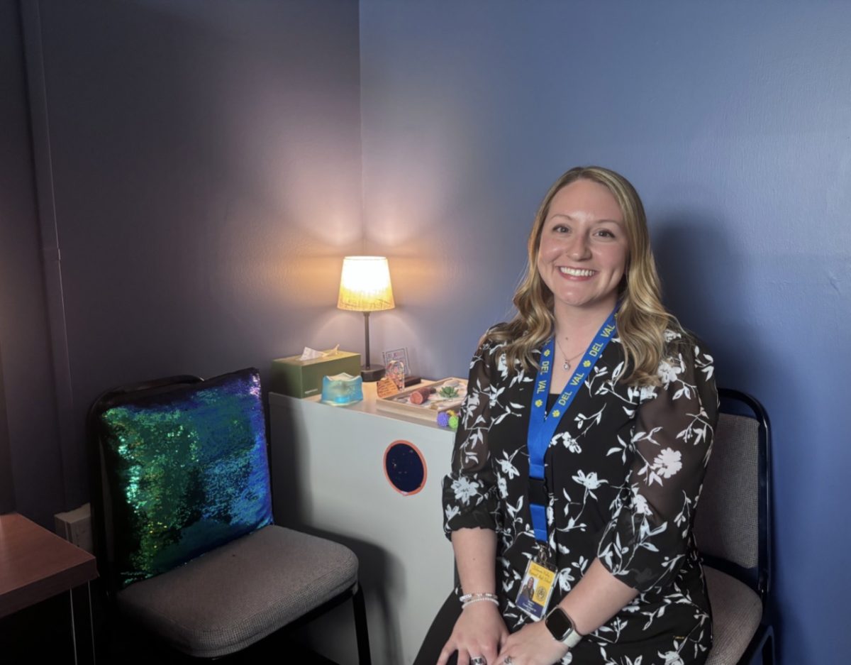 Del Val's new guidance counselor, Jocelyn Moss, sits in her office smiling. Moss began working at Del Val on March 23.