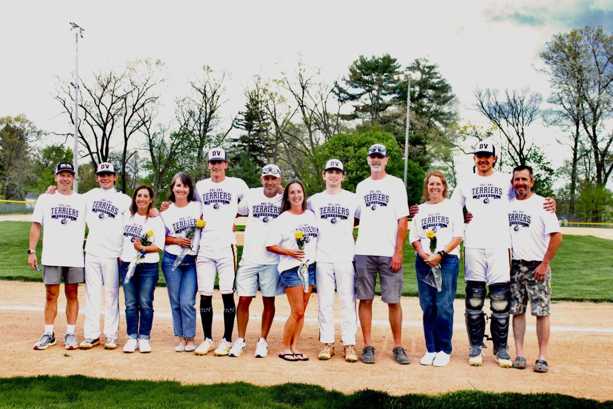 Senior parents gather around the seniors in recognition of their season.