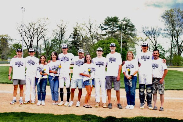 Senior parents gather around the seniors in recognition of their season.