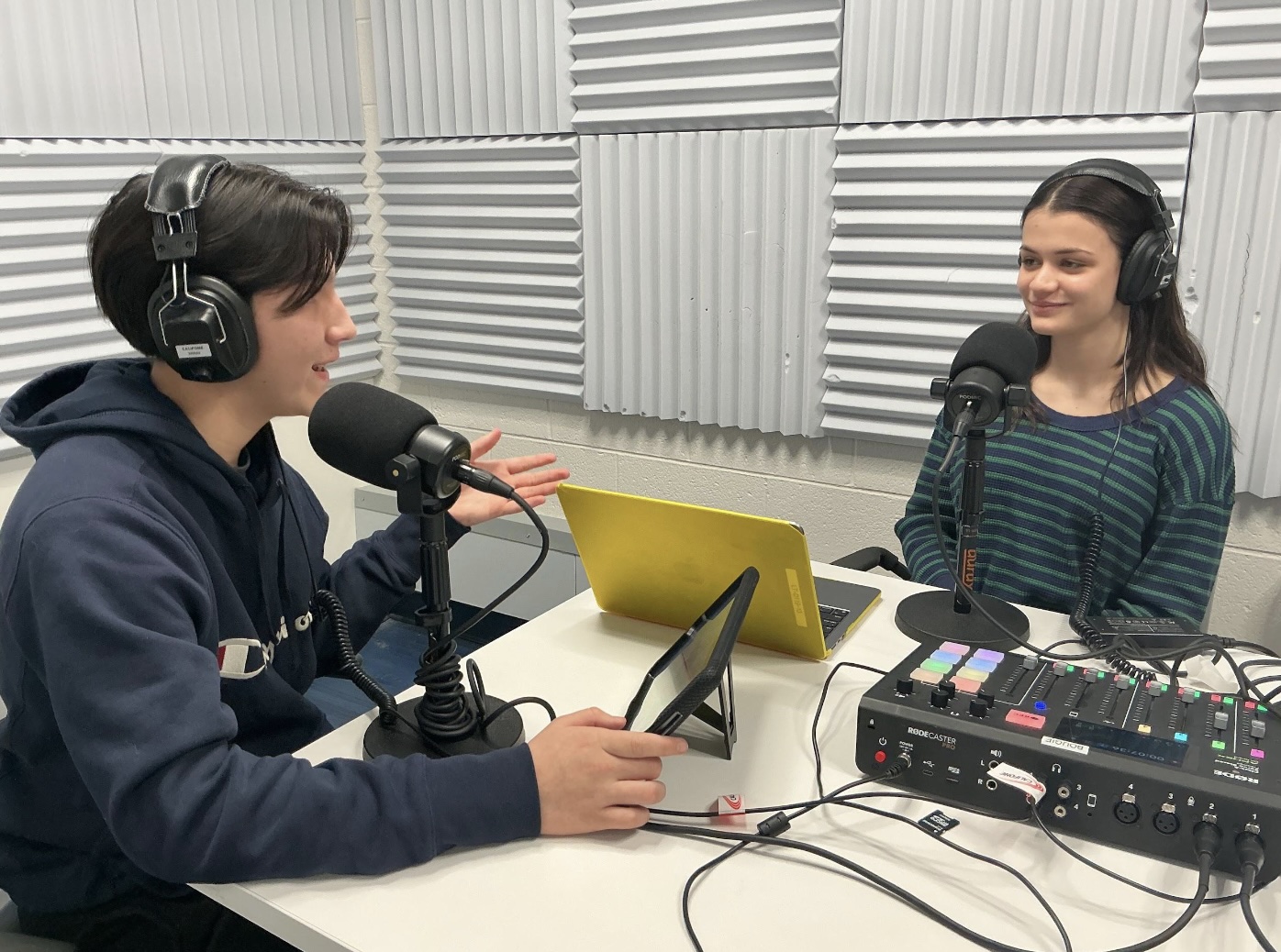 Freshman reporter Caleb Galvan records a podcast with junior editor Lillyana DeMartino. Galvan's first podcast recording exercise allowed him to create his own story thanks in part to New Voices legislation.