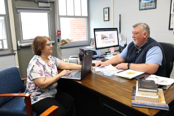 Business administrator Teresa O'Brien and superintendent Scott McKinney work on the 2026-27 school year budget. Years of state funding cuts have forced Del Val to constantly reassess its offerings for students.