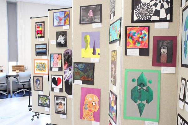 Del Val student artwork hangs in the Commons for the 2026 District Arts Festival. 35 pieces from District Arts will also be displayed at the HAM.