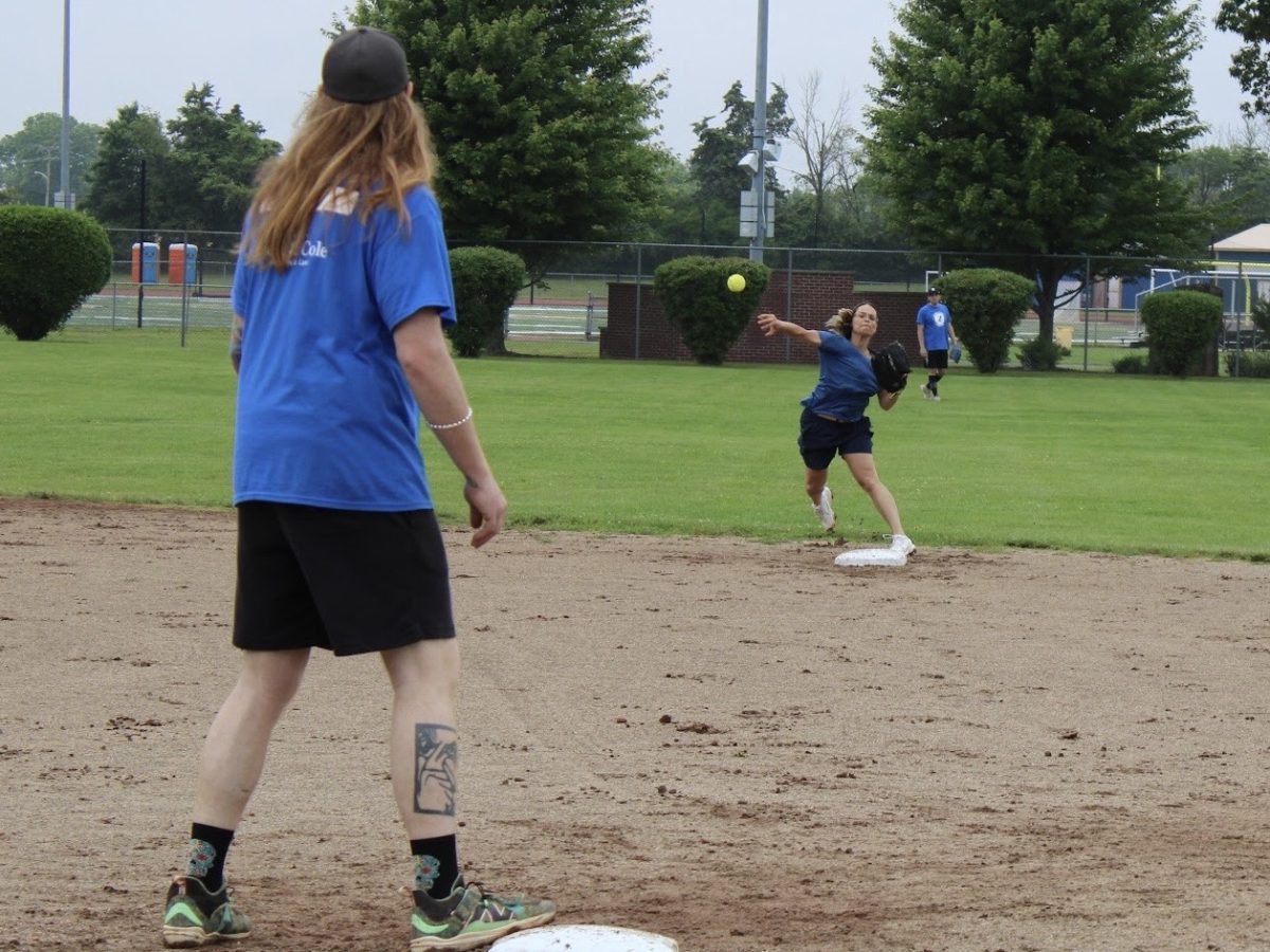 New Jersey Strike Out Hunger All-Star players Darren Ciemniecky and Gina Nobile making a play at first base at last year’s game. The team is made up of local community members. 