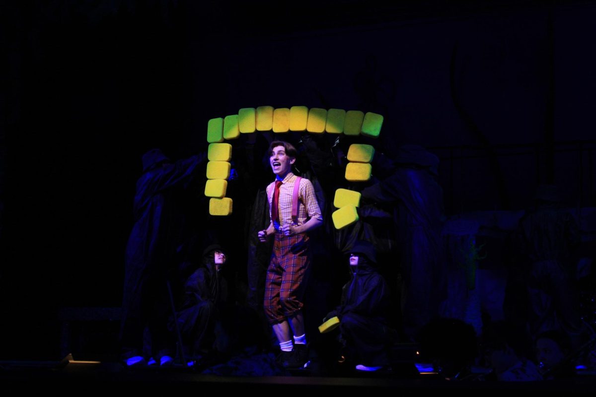 SpongeBob SquarePants played by Alex Apgar who is on stage singing "Bikini Bottom Day." Apgar took on the lead role his senior year here at Del Val.