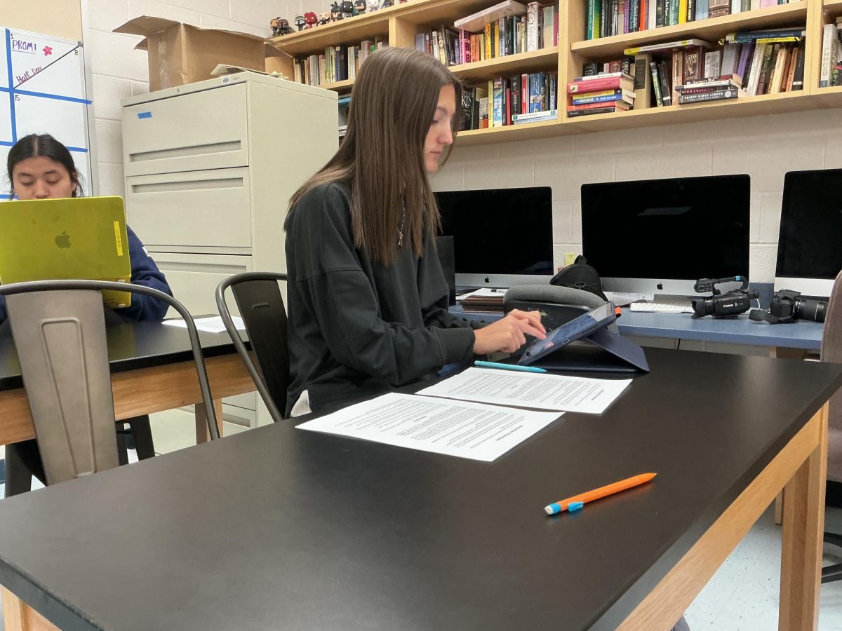 Senior Captain Leslie Knowles prepares counter questions for the upcoming debate.