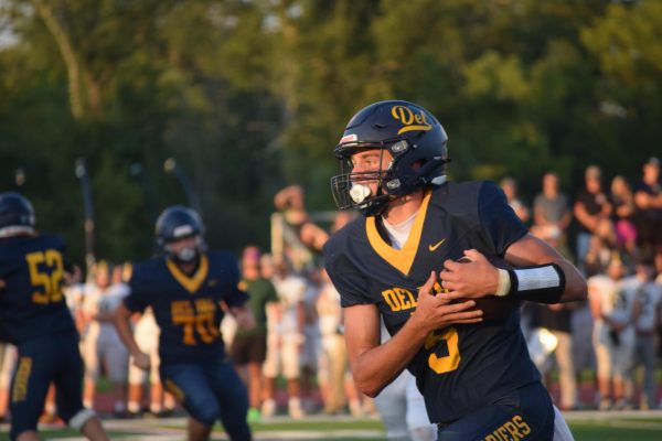 New starting varsity quarterback Chase Kraucheunas runs the ball towards the end zone. 