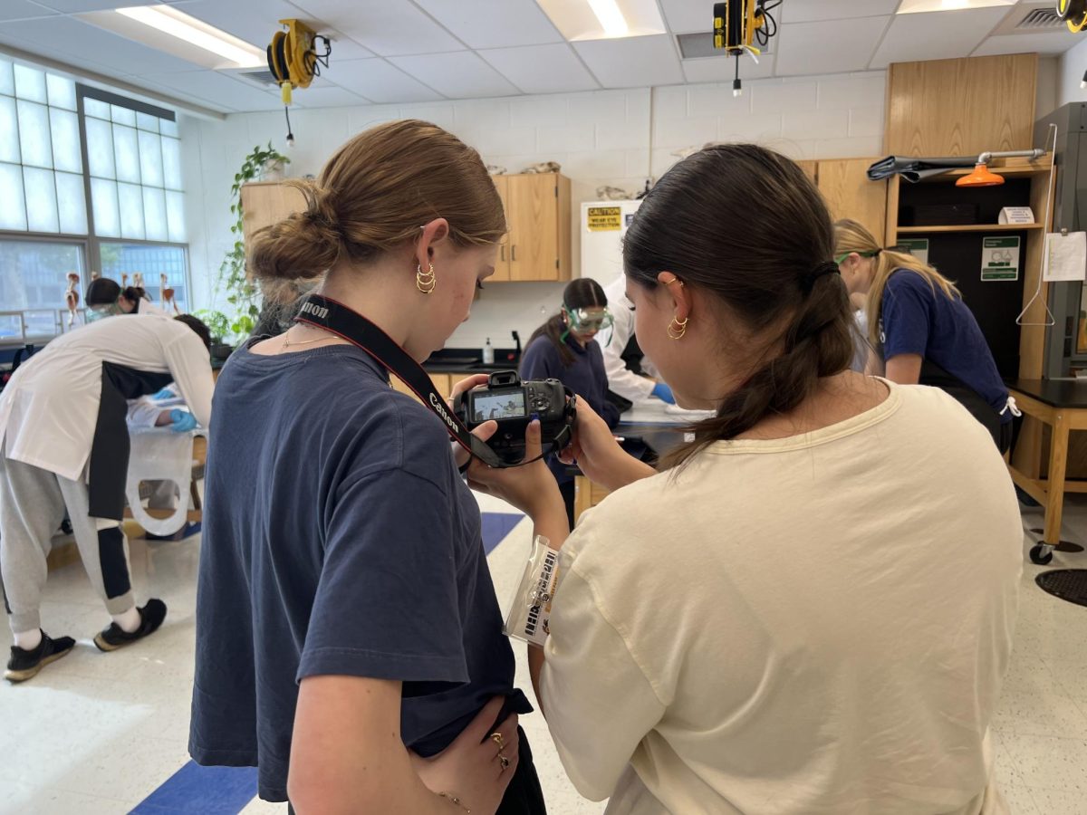Riley Nelson and Sage Hason collaborate to take photos for their upcoming story. Joining Del Val's student newspaper, The Delphi, is another way to get involved.