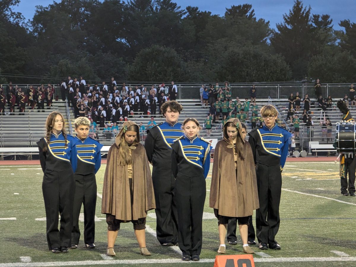 The Del Val marching band captains stand at attention as other high schools receive scores.