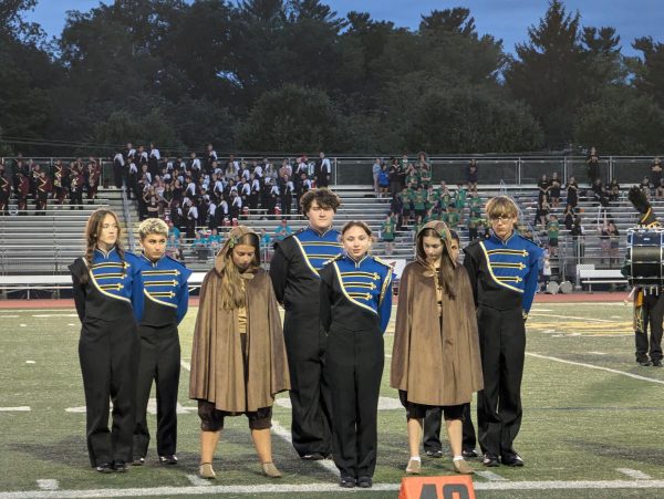 The Del Val marching band captains stand at attention as other high schools receive scores.