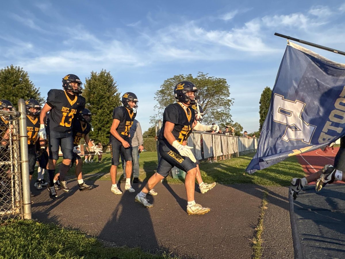 Senior players lead the team onto the field. The Terriers are looking forward to a promising season.