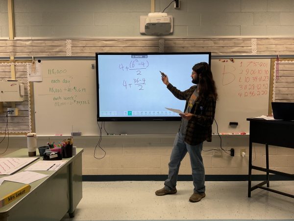 Del Val’s new math teacher Donovan Smith teaching students. Smith made the switch to teaching from a chemical engineering background.