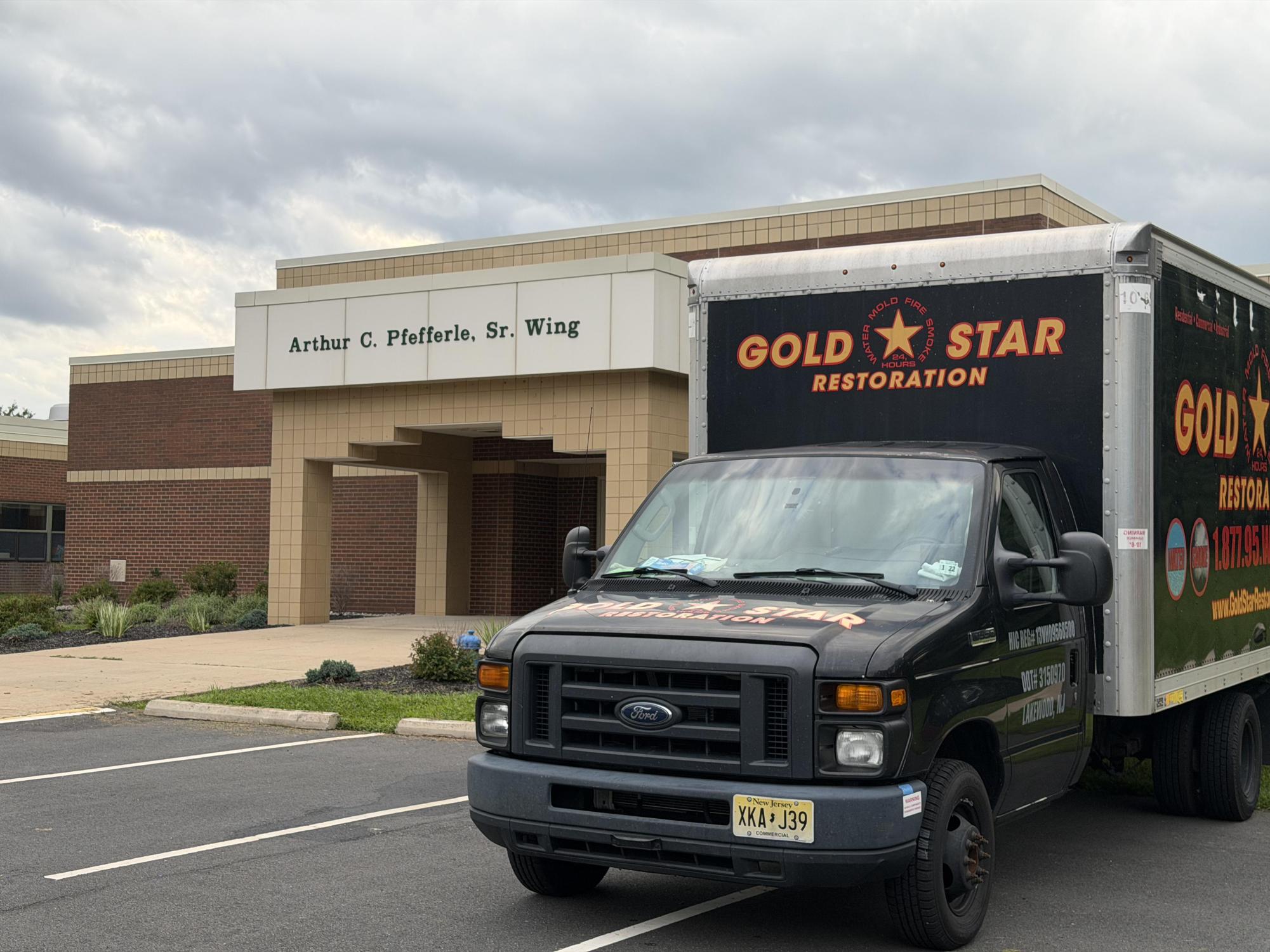 A Gold Star Restoration truck sits parked outside of the ATS Arthur C. Pfefferle, Sr. Wing. Gold Star has already begun restoration efforts.