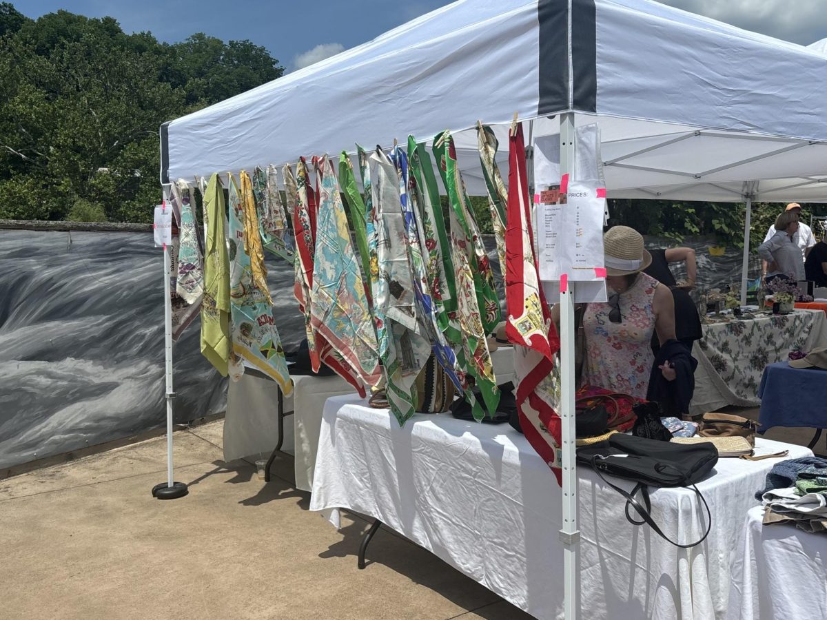 A variety of scarves are hanging on display at last year's sale. "The Artist Closet" features more than just clothes, they also sell a large span of accessaries.