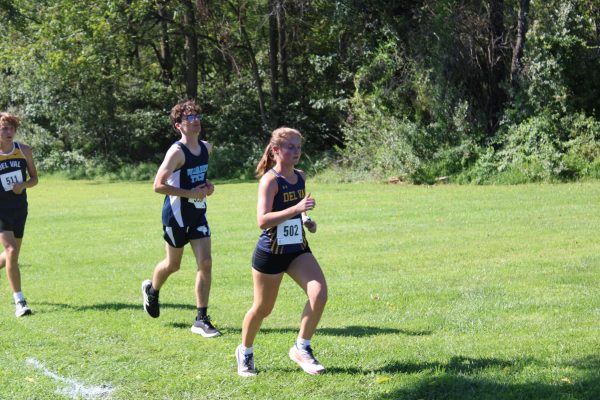 Del Val senior Erin Dushinka runs up the hill towards the tennis courts. Dushinka was honored at the Senior Night Ceremony earlier in the event.