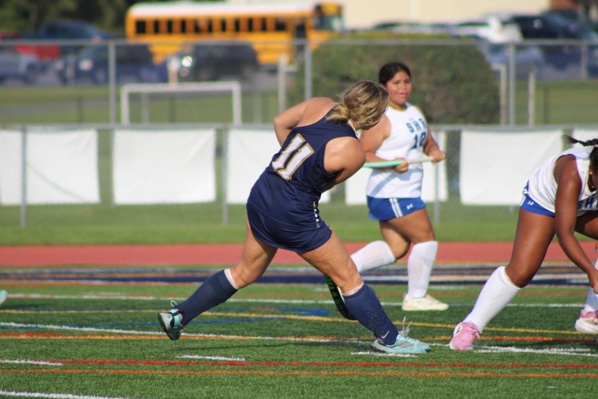 Junior Margaret Prouty scored three of the goals. She passes the ball allowing other teammates to score a goal.