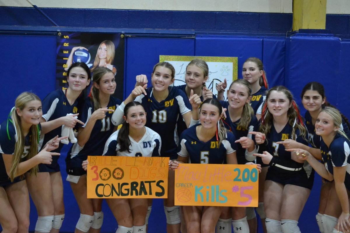 The varsity team shows off their teammates accomplishments.