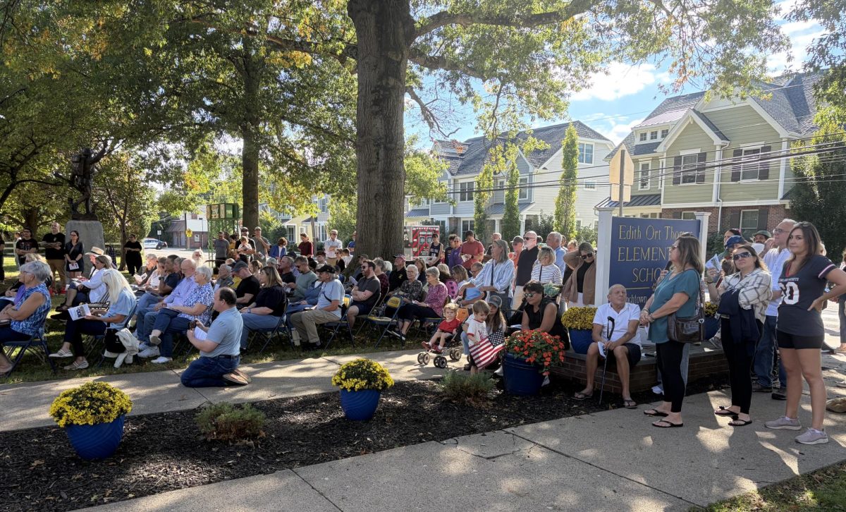 FES students, alumni and parents sit in the front yard of the school for the opening ceremony. Students in the band and choir participated in the playing of the FES Alma Mater and pep tunes. (Photo via Jeanne Herb)