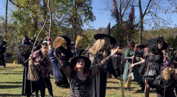 The witches hit their final pose at the end of the dance. This year, organizers Tricia Hurley and Kelly Kinney added additional dances to the beginning of the event which increased the amount of preparation required. “It's a lot of meeting up and dancing and practicing,” Kelly Kinney said. “We’ve been coming to this park twice a week basically since the summer. There’s a lot of devotion and dedication there.”